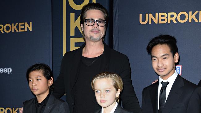 Brad Pitt with three of their children, Pax, Shiloh and Maddox in 2014. Picture: AFP