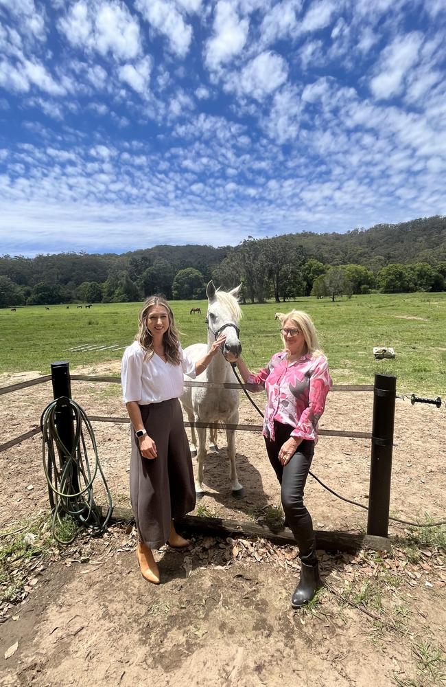 Currumbin MP Laura Gerber and Rae-Anne Holmes with rescue horse in front of their property which will soon be Currumbin Eco Parklands