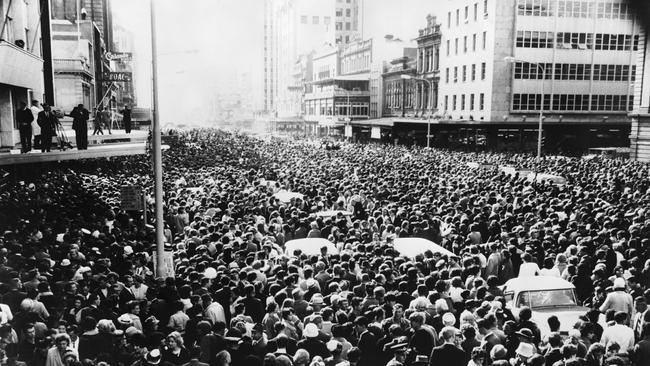 A vast crowd gathers outside the Town Hall in King William Street, to welcome the Beatles to Adelaide. (Photo by Keystone/Getty Images)