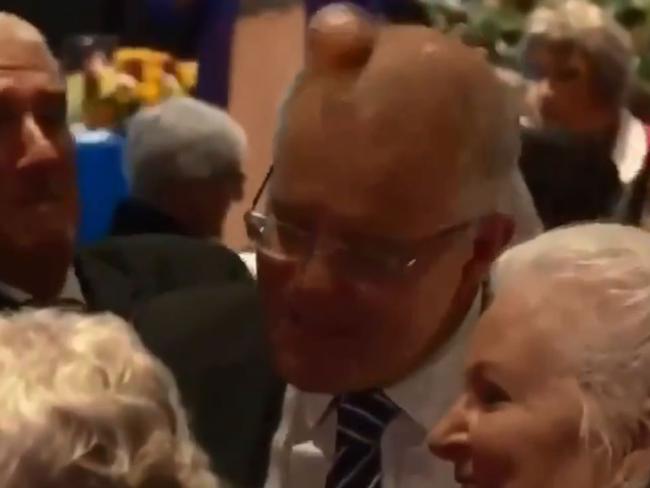 An egg just misses Scott Morrison's head at the CWA event in Albury. Picture: Channel 7