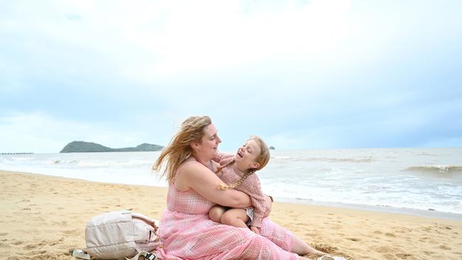 Meg and Mia Bromley enjoy the weather at Palm Cove. Emily Barker