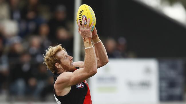 Essendon ruckman Andrew Phillips rises to mark against Geelong in Colac.