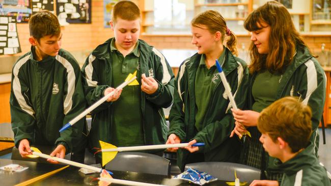 Kadina High’s Year 8 Endeavour STEM class students Cooper, Page, Elanor, Ciara and Sam prepare their rockets for a test flight.