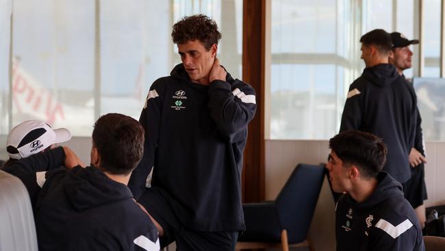 Ed Curnow chats with teammates waiting to fly. Picture: Cristian Filippo, Carlton Football Club