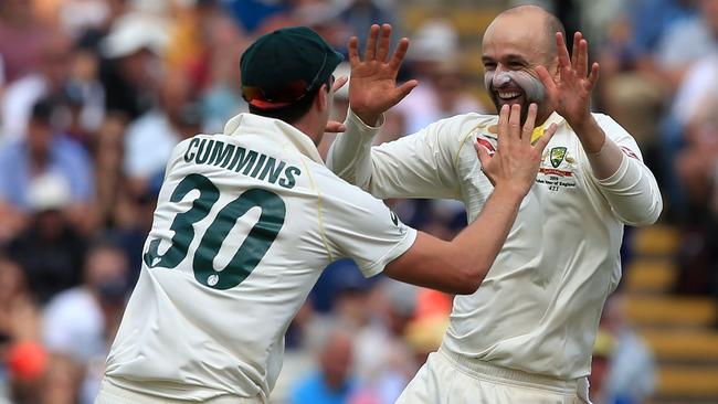 Nathan Lyon and Pat Cummins celebrate Australia’s big victory.