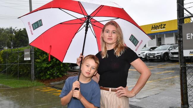 Denise Howard and son Jock, 7, outside the Hertz car depot on Nudgee Rd last year. A McDonald’s is planned for the site. Picture, John Gass