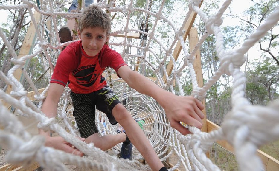 Sydney Scholes from Perth makes his way through the ropes maze at the 2013 Australian Scout Jamboree. Picture: Alistair Brightman