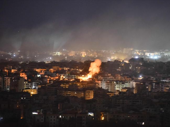 Smoke rises from the site of an Israeli airstrike that targeted a neighborhood in Beirutâs southern suburb early on October 1, 2024. (Photo by Fadel ITANI / AFP)