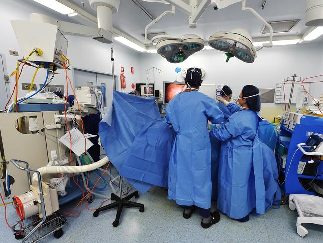 Surgeons Ray Gafaar and Dr Nancy Suh with nurse Jackie at the back. Picture: Ellen Smith