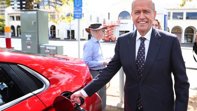 The Leader of the Opposition, Bill Shorten charging an electric car at the launch of Labor's Climate Change Action Plan at ACTEWAGL Electric Car Charging Station in Canberra.. Picture Kym Smith