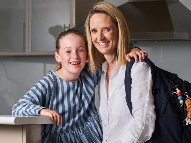 Remi, 8 with her mum, Sarah Brown at home after school in Fulham Gardens. Picture: Matt Loxton