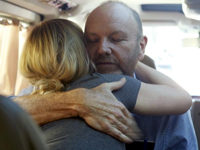 Producer Stephen Rice embraces Sally Faulkner. Picture: REUTERS/Mohamed Azakir