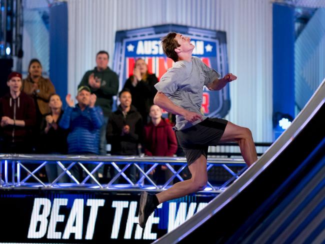 Alex Cusack attempts the Warped Wall on Australian Ninja Warrior. Picture: Nine