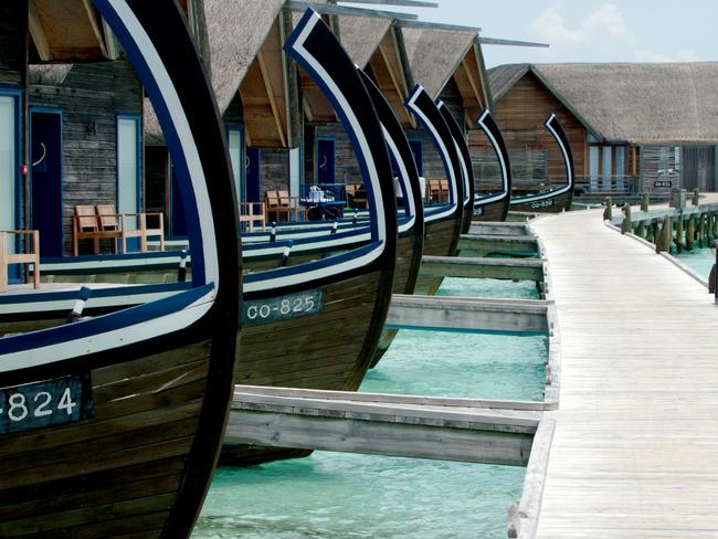 Everyone gets a personal jetty at the Cocoa Island Resort, Maldives. Photographer: John Borthwick