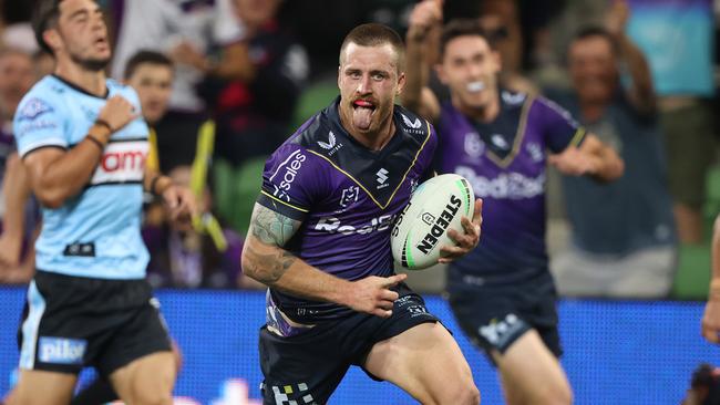 MELBOURNE, AUSTRALIA - APRIL 16: Cameron Munster of the Storm celebrates on his way to scoring a try during the round six NRL match between the Melbourne Storm and the Cronulla Sharks at AAMI Park, on April 16, 2022, in Melbourne, Australia. (Photo by Robert Cianflone/Getty Images)