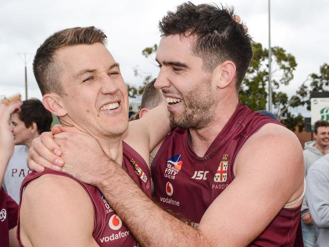 Jack Trengove and Cam Giles celebrate after winning the 2021 Adelaide Footy League division one grand final against Payneham Norwood Union. Picture: Brenton Edwards