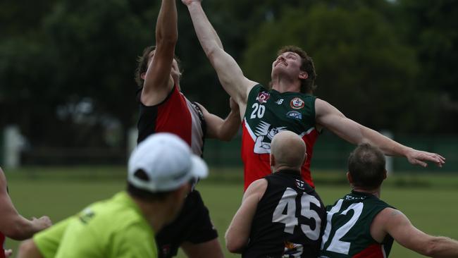 South Cairns Cutters player Josh Rolfe reaches for the mark. Picture: Harry Murtough