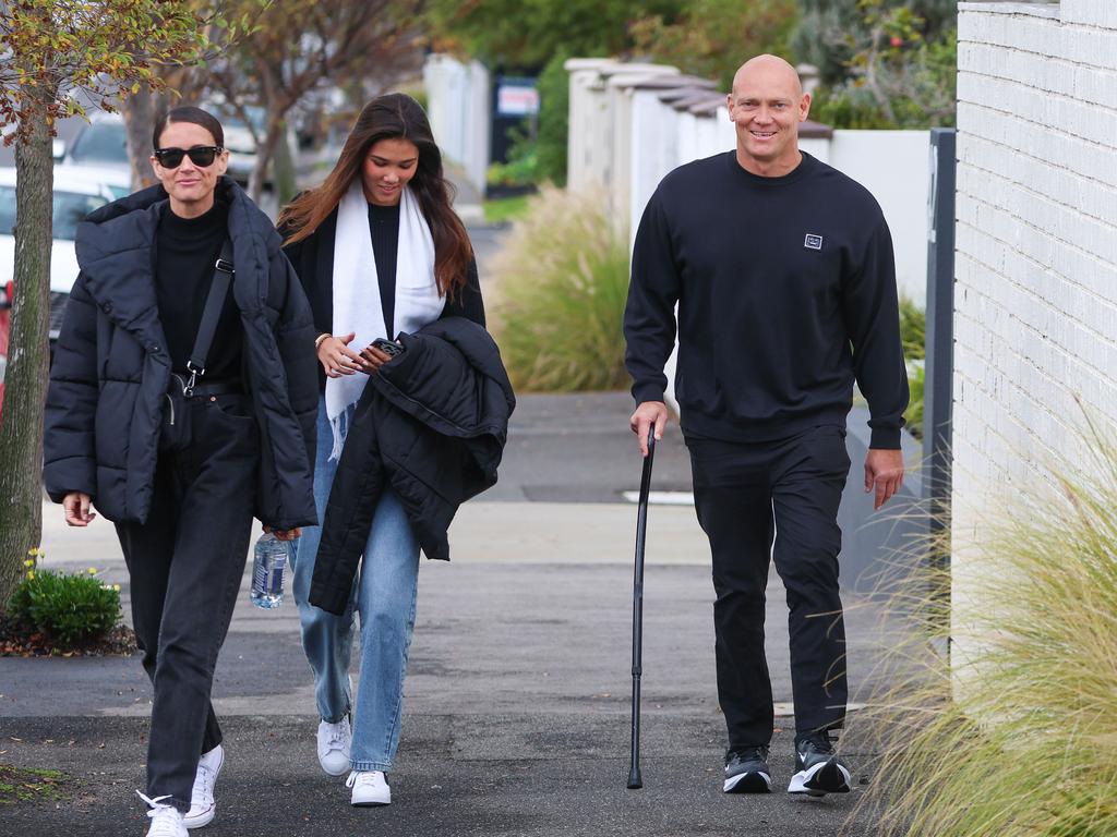 Michelle Owen, daughter Stella and Michael Klim with a walking stick.  Image: Brendan Beckett