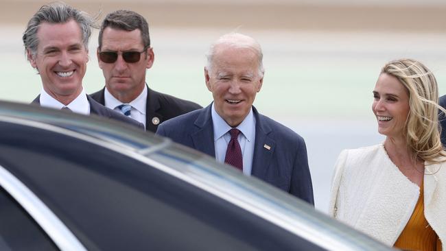 Joe Biden is met at the airport by California Governor Gavin Newsom and his wife Jennifer Siebel Newsom. Picture: Getty Images