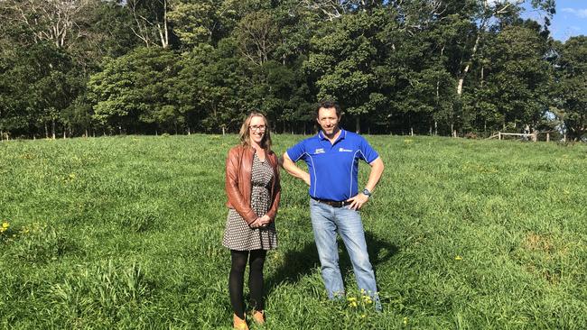 North Coast Community College executive officer Kate Kempshall with NSW Department of Primary Industries' North Coast manager, Bill Quince, in the indigenous bush food paddock with the Big Scrub remnant behind.