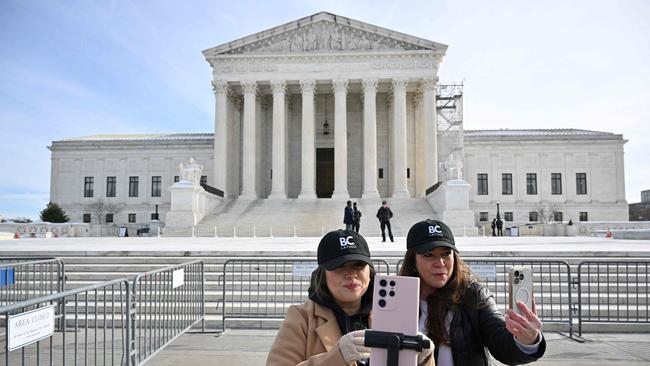 Supporters of Tiktok livestream in front of the US Supreme Court in Washington, DC. Picture: AFP