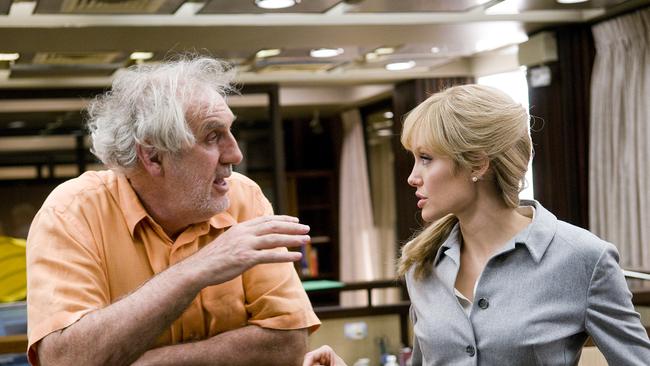 Director Phillip Noyce with actor Angelina Jolie on set during filming of Salt.