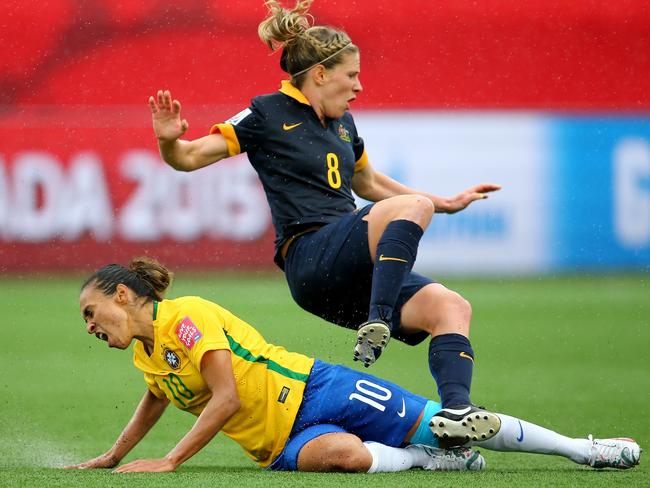 Brazil’s Marta slides into Australia’s Elise Kellond-Knight during their match played on sytnthetic turf at the Women’s World Cup in Canada in 2015. Picture: Getty Images