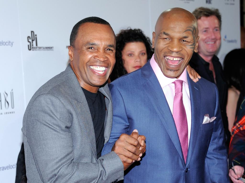 Former boxers Sugar Ray Leonard and Mike Tyson. (Photo by Ethan Miller/Getty Images)