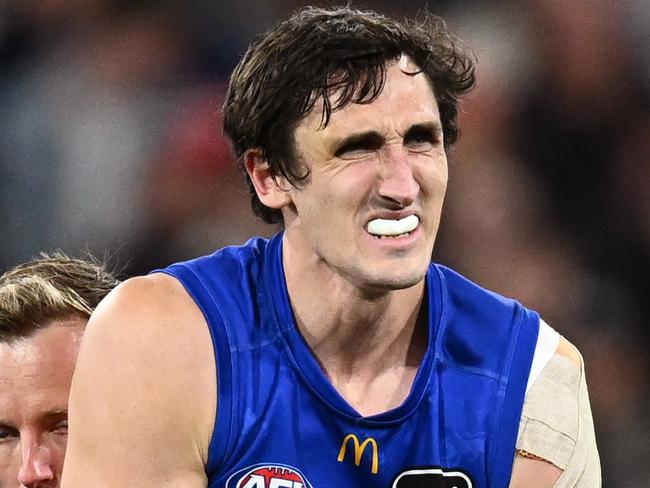 MELBOURNE, AUSTRALIA - SEPTEMBER 21: Oscar McInerney of the Lions receives medical attention in the second half during the AFL Preliminary Final match between Geelong Cats and Brisbane Lions at Melbourne Cricket Ground, on September 21, 2024, in Melbourne, Australia. (Photo by Quinn Rooney/Getty Images)