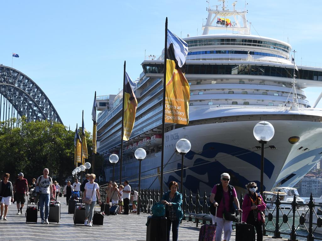 Cruise ship passengers leave the Ruby Princess at Circular Quay, Sydney on March 19. More than 660 cases and 28 deaths were linked to a coronavirus outbreak on the ship. Picture: Dean Lewins