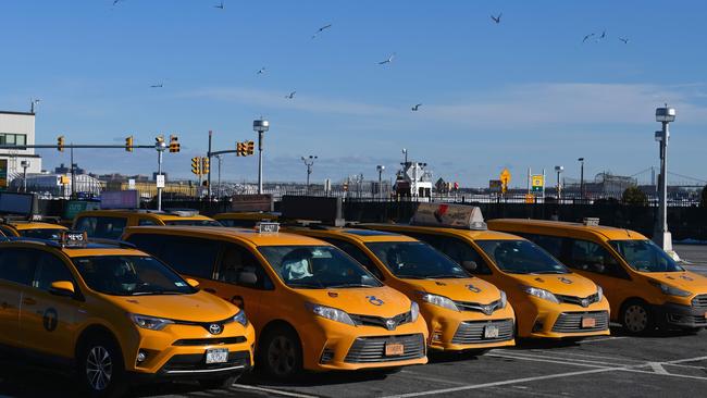 Yellow cab taxis parked at LaGuardia Airport in New York City on February 4. They were omnipresent on the streets of New York day and night, as emblematic of the Big Apple as the Empire State Building or Yankees caps. But the pandemic has made yellow taxis scarce and facing an uncertain future. Picture: Angela Weiss/AFP)