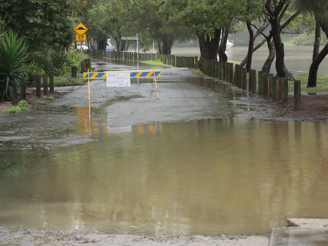 Water rising at Carina Rd in Picnic Point. Picture: John Grainger