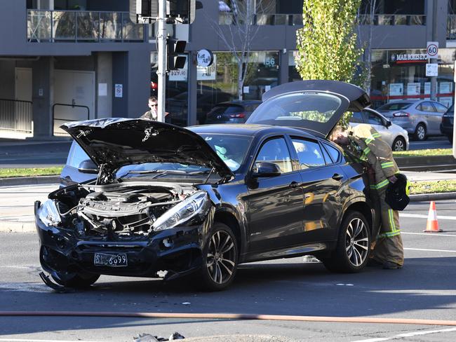 The damaged BMW collided with the ambulance. Picture: AAP/James Ross