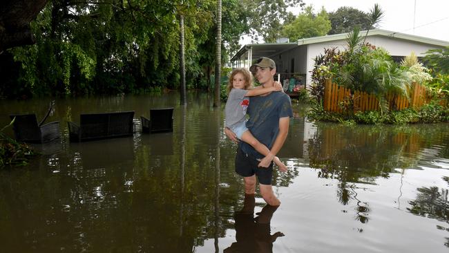 Daniel Leoni, with niece Bella McIlwain, 6, in Suttor Street outside their Mysterton home. He said there was no doubt there was sewage in the water that inundated his home on Wednesday. Picture: Evan Morgan