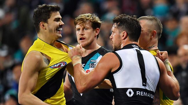 Oleg Markov of the Tigers and Travis Boak of the Power wrestle at Adelaide Oval. Picture: Daniel Kalisz (Getty Images)