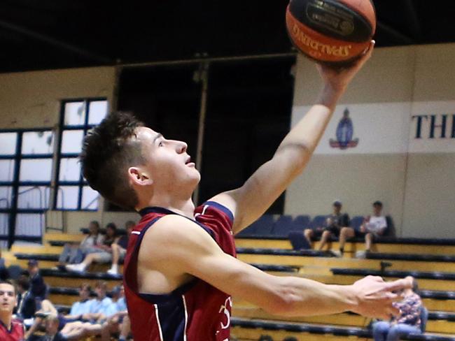 It's old boys day this weekend at TSS.TSS basketball (maroon) vs. BGS.Photo of Preston Le Gassick.Photo by Richard Gosling.