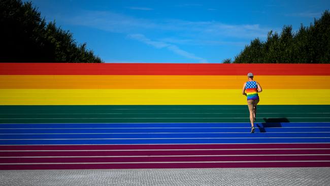 A man walks on steps covered in rainbow colors for New York City’s Pride Month last month. Picture: Johannes Eisele/AFP)