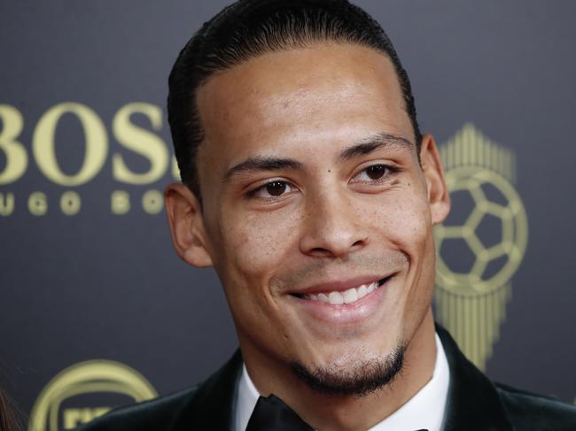 Liverpool's Virgil van Dijk poses during the Golden Ball award ceremony at the Grand Palais in Paris, Monday, Dec. 2, 2019. Awarded every year by France Football magazine since Stanley Matthews won it in 1956, the Ballon d'Or, Golden Ball for the best player of the year will be given to both a woman and a man. (AP Photo/Francois Mori)