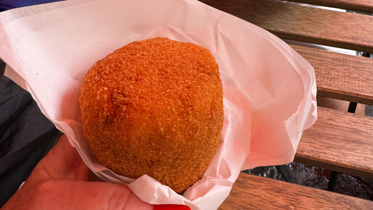 <h2><span>1. Arancino</span></h2><p><span>You&rsquo;ve seen plenty of round rice arancini balls with a cheesy centre served on platters, but you need to go to Catania to find Sicily's best. Their golden-fried cone-shaped arancino, as they call them here, are stuffed with hearty fillings like rag&ugrave;, mozzarella, and peas. The locals say enjoy them upside down, with the filling on top! Try it at Antica Rosticceria Catanese, where they have been making arancino since 1910.&nbsp;</span></p><p><em>Picture: Kerry Heaney</em></p>