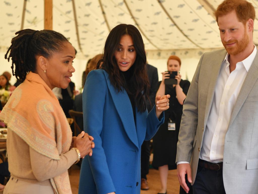 Meghan, Duchess of Sussex arrives with her mother Doria Ragland and Prince Harry to host the launch of a cookbook authored by Grenfell Tower fire survivors. Picture: Getty Images