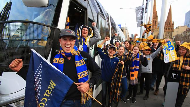 28/09/18 William Johnston (left) with other West Coast fans arrive in Melbourne after a 44 hour bus ride from Busselton in WA. Aaron Francis/The Australian