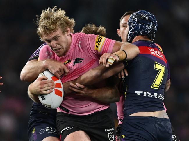 SYDNEY, AUSTRALIA - OCTOBER 06: Lindsay Smith of the Panthers is tackled by Jahrome Hughes of the Storm during the 2024 NRL Grand Final match between the Melbourne Storm and the Penrith Panthers at Accor Stadium on October 06, 2024, in Sydney, Australia. (Photo by Quinn Rooney/Getty Images)