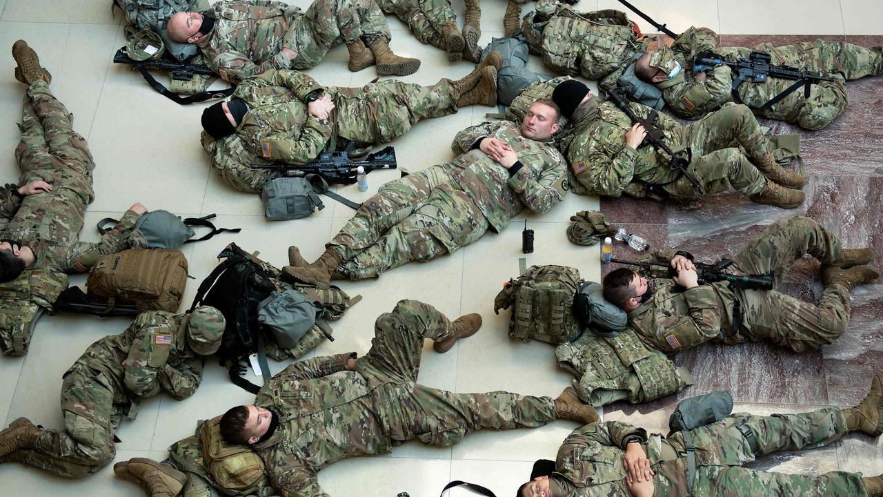 Members of the National Guard rest in the Capitol Visitors Centre on Capitol Hill in Washington, DC. Picture: Brendan Smialowski / AFP