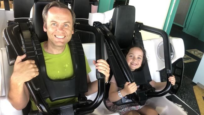 Gold Coast Bulletin reporter Keith Woods with daughter Lucia at Dreamworld last year.