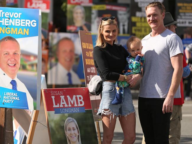 23/7/2018: Voters Judy and Chris Perry with 10mth old Chase are almost overwhelmed with the huge amounts of political party advertising  at a Longman pre poll at Morayfield, north of Brisbane. Lyndon Mechielsen/The Australian