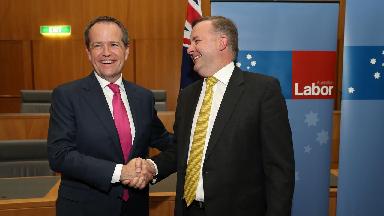 The new Labor Leader, Bill Shorten, receives congratulations from Anthony Albanese.