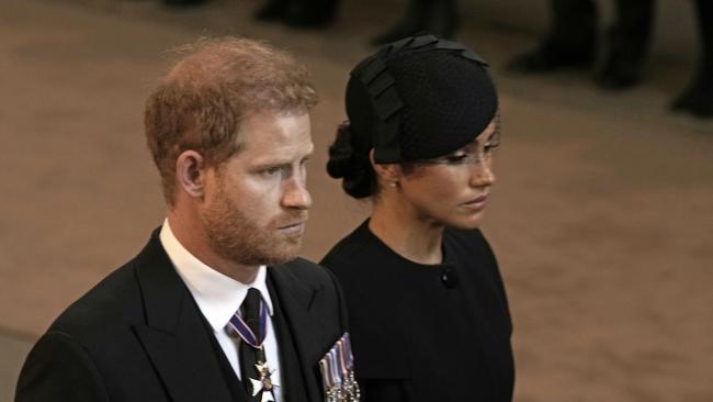 Prince Harry, Duke of Sussex and Meghan, Duchess of Sussex leave Westminster Hall.