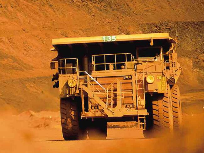 In this photograph supplied by BHP Billiton, a truck works at the BHP Billiton iron ore mine at Mt Whaleback at Newman in the Pilbara, Western Australia, in this undated photo.