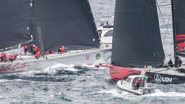 LDV Comanche (right) and Wild Oats XI narrowly miss each other during the start to the Sydney-to-Hobart. Picture: AAP