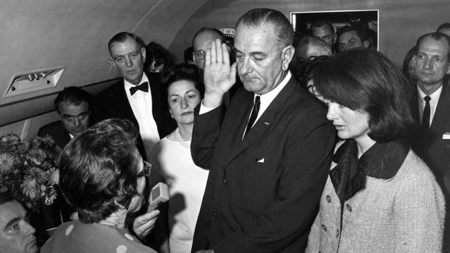 Judge Sarah T. Hughes administers the Presidential Oath of Office to Lyndon Baines Johnson aboard Air Force One, at Love Field, Dallas, Texas, before witnesses including Jacqueline Kennedy. Picture: Cecil Stoughton, White House/John Fitzgerald Kennedy Library, Boston